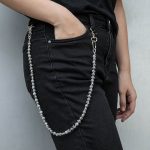 Female model wearing 70cm zinc alloy Cross Beaded Pocket Chain to showcase length and fit for Accessory Brands