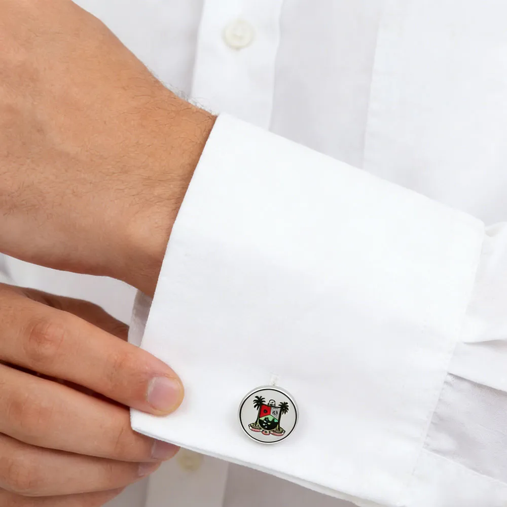 Male Model Wearing Custom Cufflink Featuring Elements of Tribal Badge and Palm Trees for Jewelry Brand