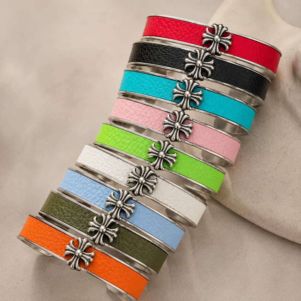 Custom leather cuff bracelet with colorful leather inlays and stainless steel frame, designed for OEM jewelry brands seeking durable bracelet manufacturing and personalized color options.